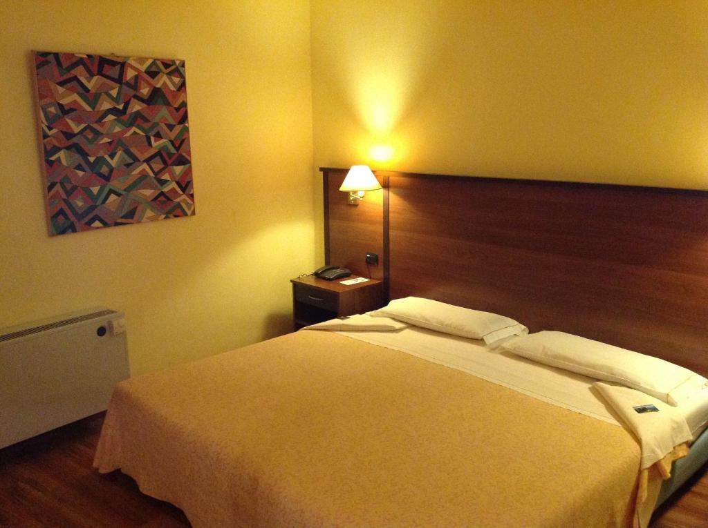 Postel nebo postele na pokoji v ubytování Hotel Bel Sit