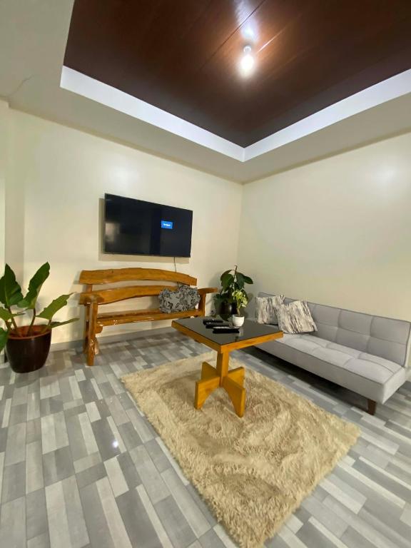 a living room with a couch and a table at Tiny Home fronting Alburquerque Church in Alburquerque