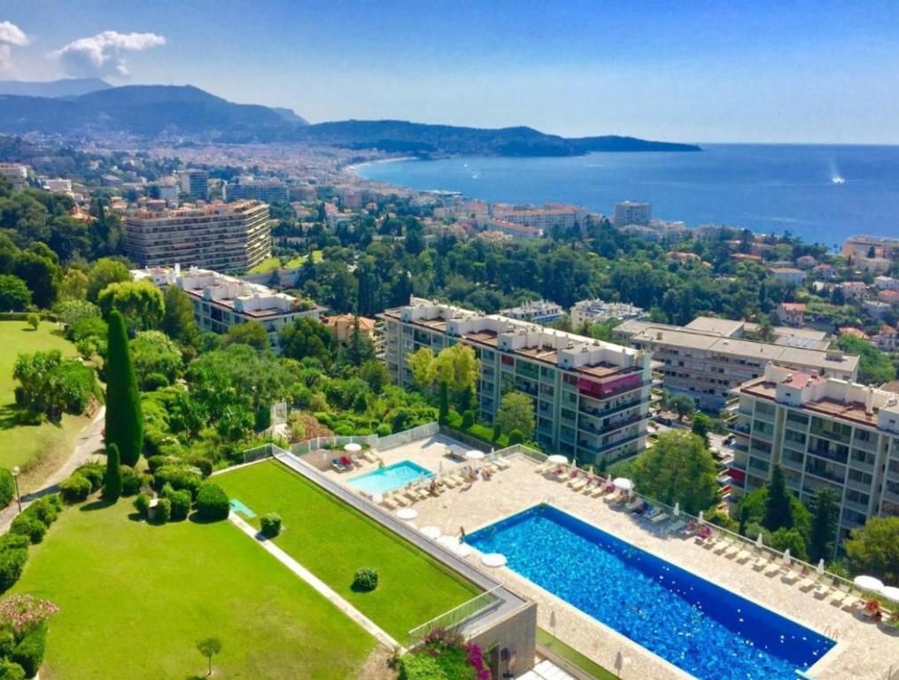 an aerial view of a park with a swimming pool at Studio in a luxury community in Nice