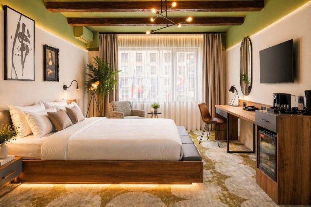 a bedroom with a bed and a desk and a television at Bucharest Comfort Suites Hotel in Bucharest