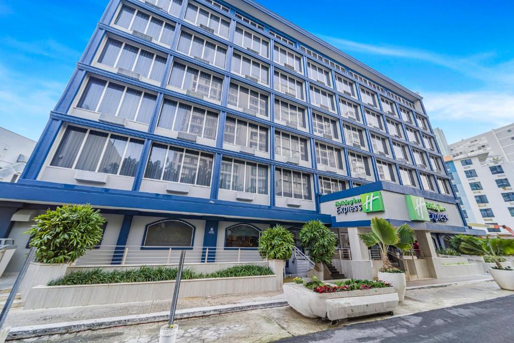 a blue building with plants in front of it at Holiday Inn Express San Juan Condado by IHG in San Juan