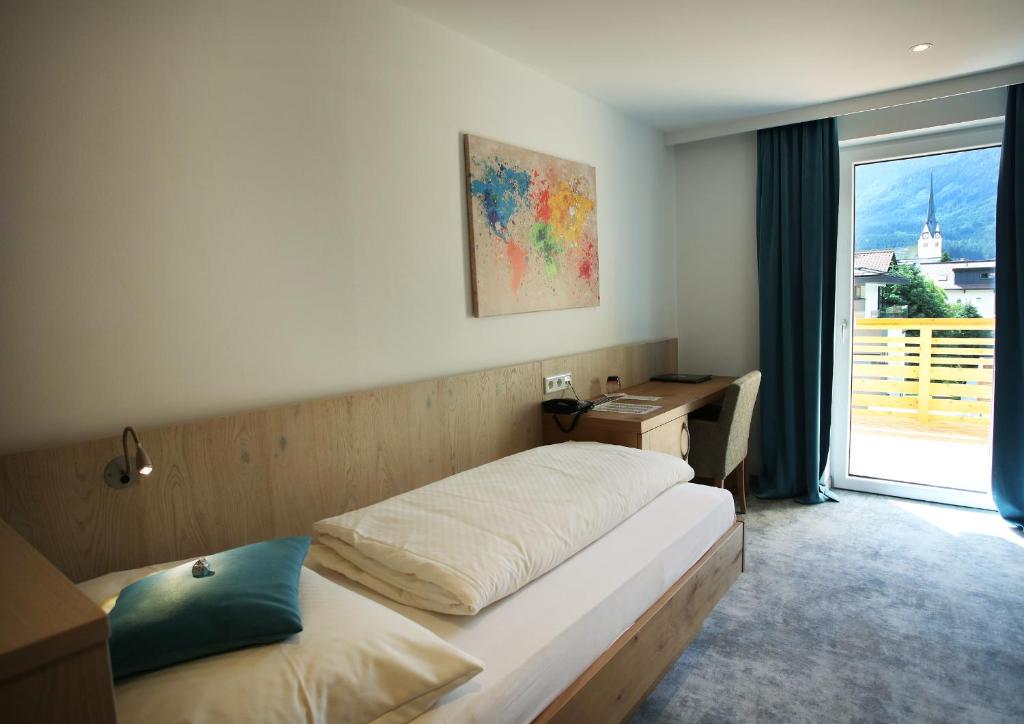 Postel nebo postele na pokoji v ubytování Aktiv- und Wellnesshotel Gutjahr