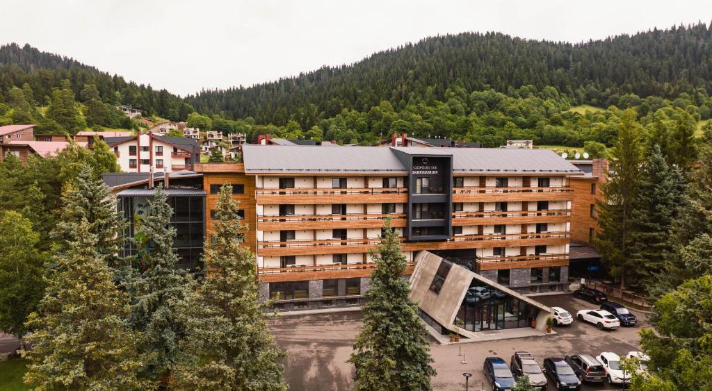 an aerial view of a hotel in the mountains at Bakuriani Inn in Bakuriani