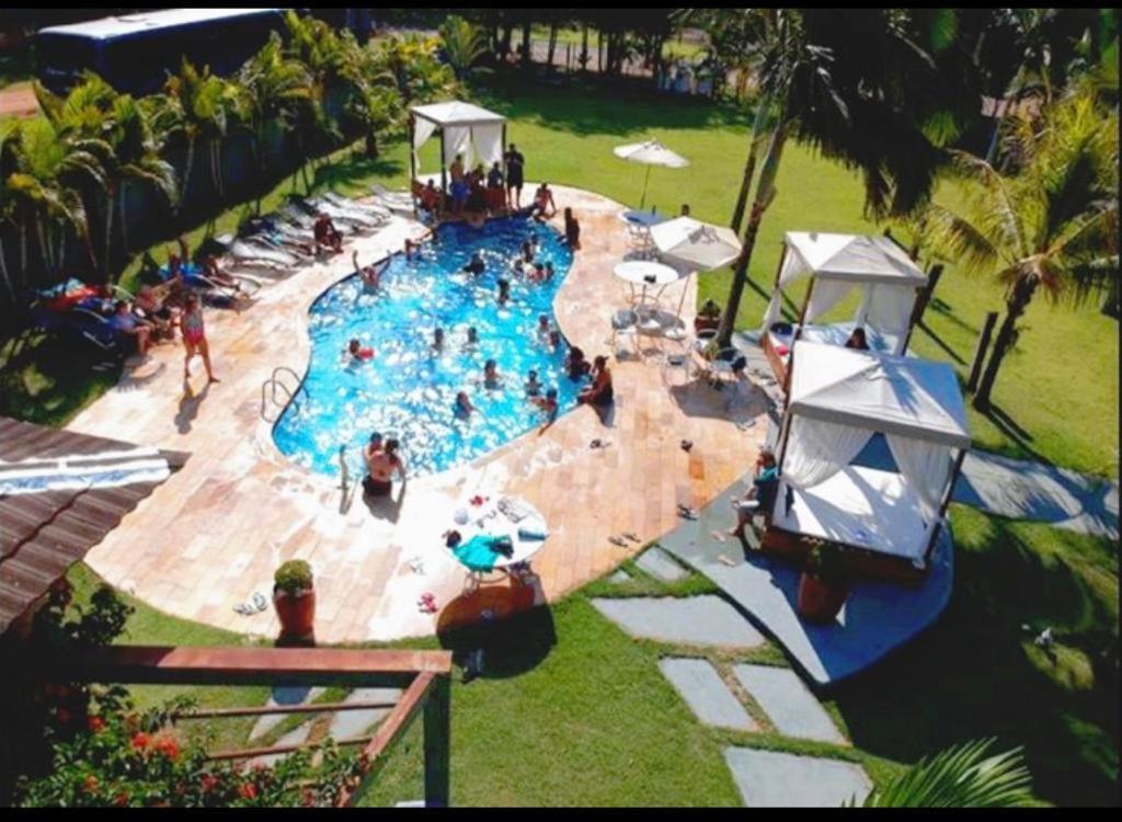 an overhead view of a swimming pool with people in it at La Dolce Villa in Avaré