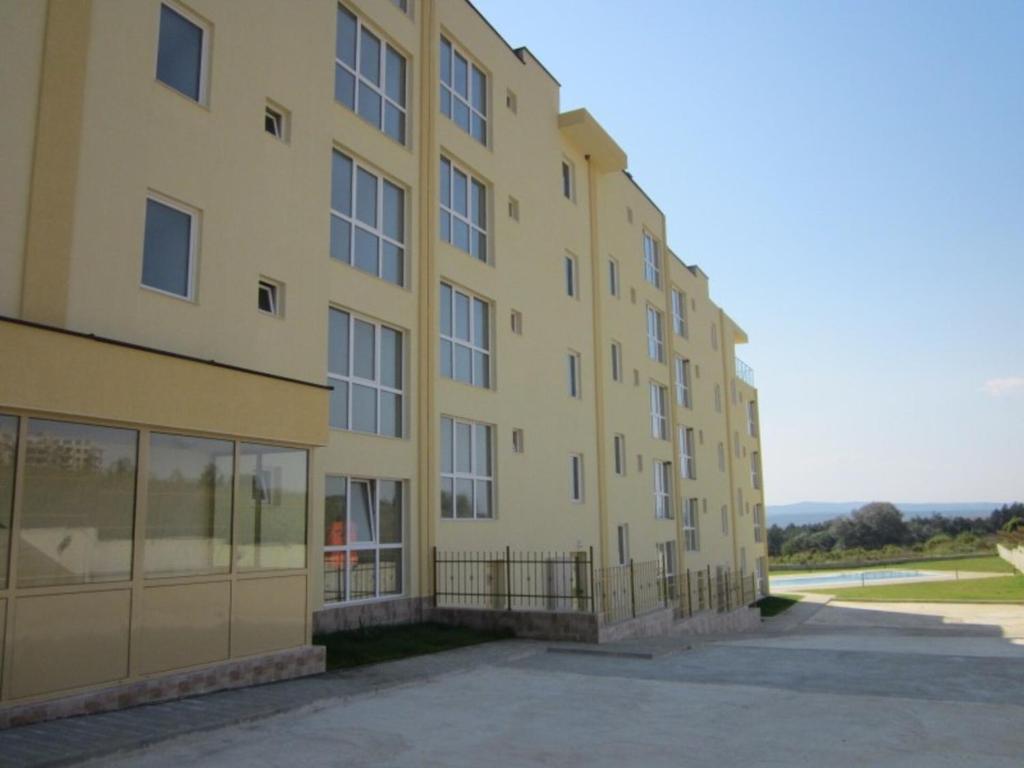 a large yellow building with a lot of windows at Апартамент Лана 2 in Byala