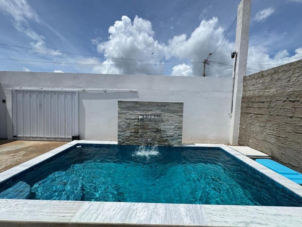 a swimming pool in the backyard of a house at Casa em Tibau in Tibau