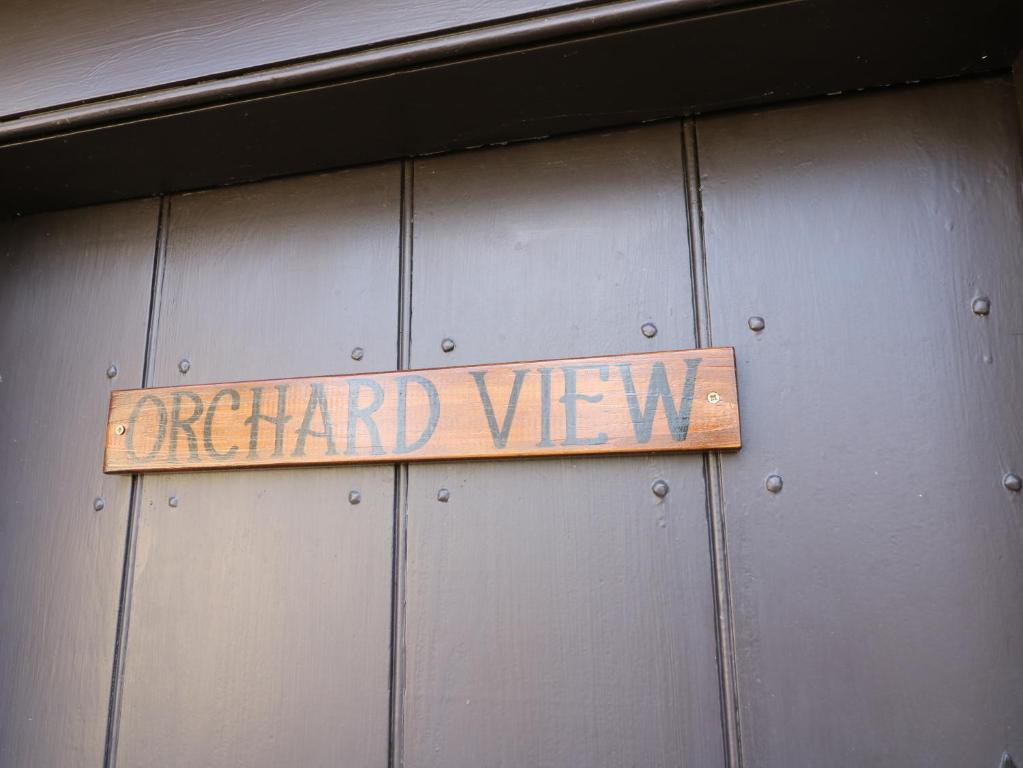 a sign that reads emerald view on a metal wall at Orchard View in Alfreton