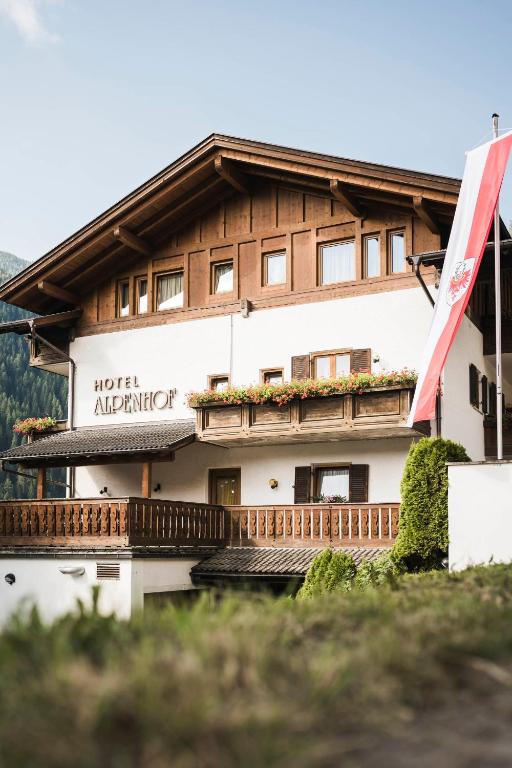a building with a sign that reads hotel alpha antipolis at Hotel Alpenhof in Ultimo