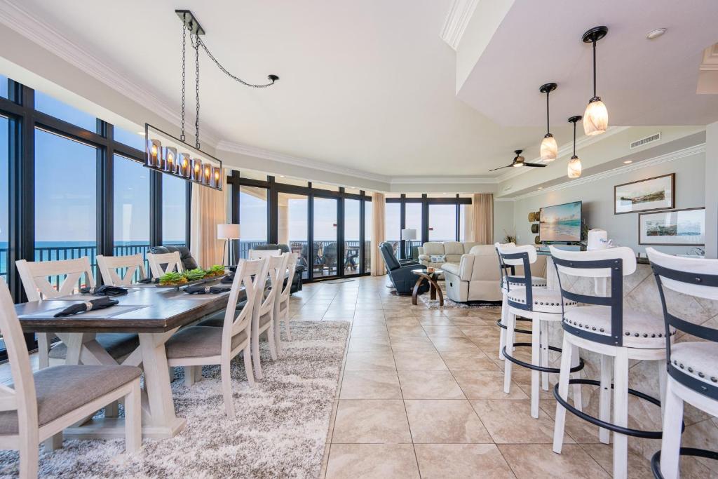 a dining room with a view of the ocean at The Oasis 411 formerly Phoenix West II 411 in Orange Beach