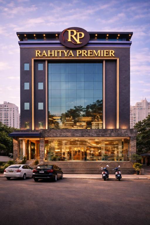 a building with two motorcycles parked in front of it at Rahitya Premier in New Delhi