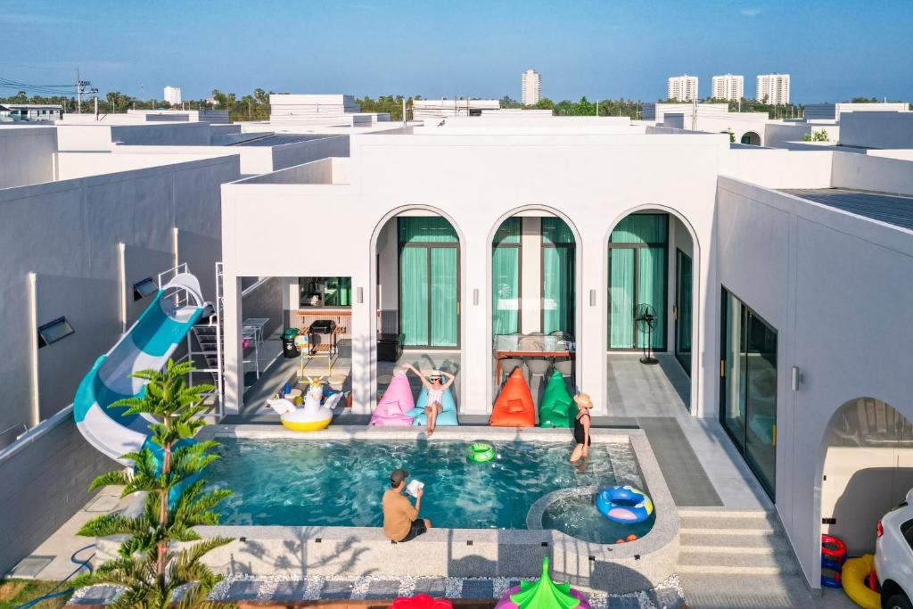 a swimming pool on the roof of a house at Baby Blue pool villa in Ban Bo Prakhon