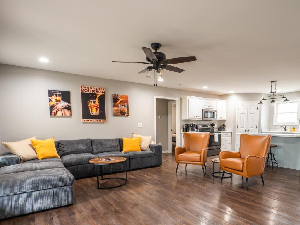 a living room with a couch and chairs and a kitchen at Haven Hill House - Scenic Getaway near Bardstown & Bourbon Trail in Springfield