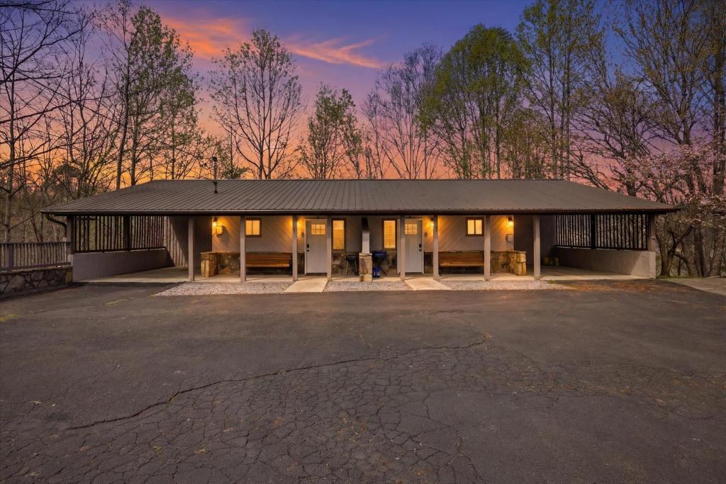 a building with a parking lot in front of it at Working 9 to Pine by Beyond Expectations with Views in Sevierville