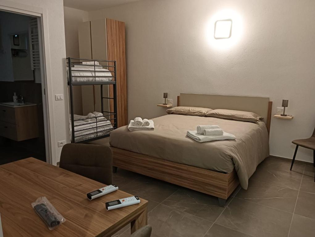 a bedroom with a bed with towels on it at Apartment for 4 in Cairo Montenotte