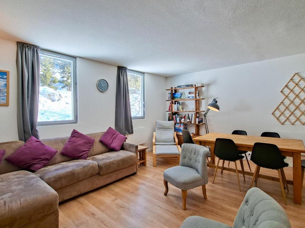 a living room with a couch and a table at Appartement 3 pièces à Flaine, 6 pers, moderne et confortable - FR-1-425-3 in Flaine