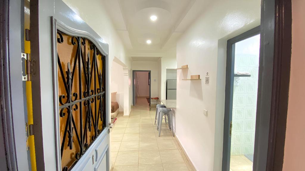 a hallway with a hallway leading to a room at RESIDENCE OUARZAZATE in Ouarzazate