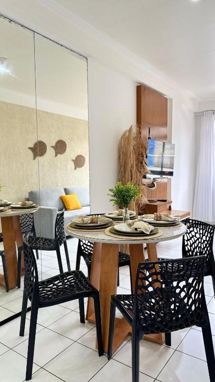 a kitchen and dining room with a table and chairs at (103) Coastal seaside - Pebble in Pimenta