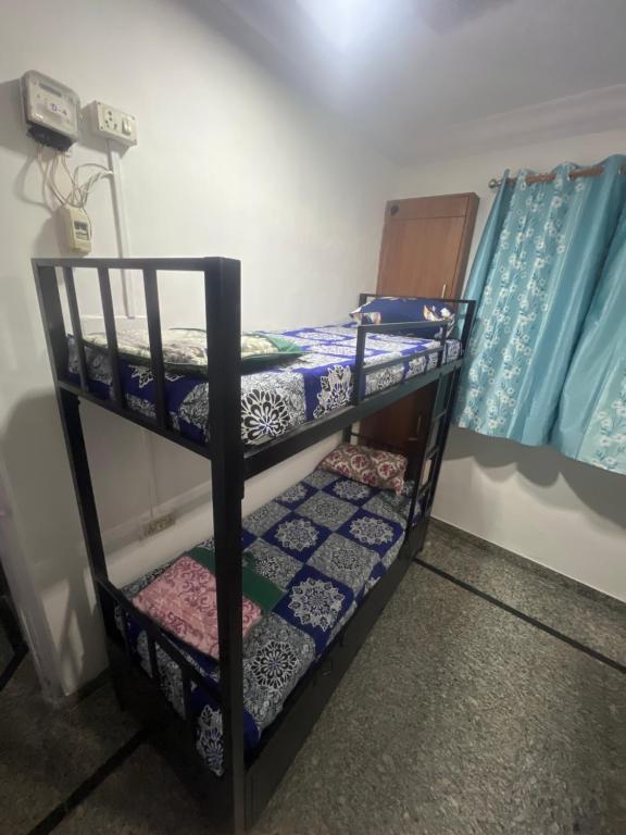 a couple of bunk beds in a room at BEYOND INFINITY GROUP, pg in Navi Mumbai