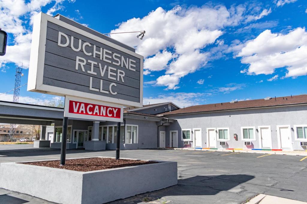 a building with a sign that reads duchessine never lie at Duchesne River LLC in Duchesne
