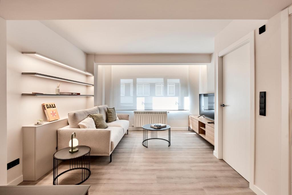 a living room with a couch and a table at AHH ATLANTIC HORIZON HOMES fa in A Coruña