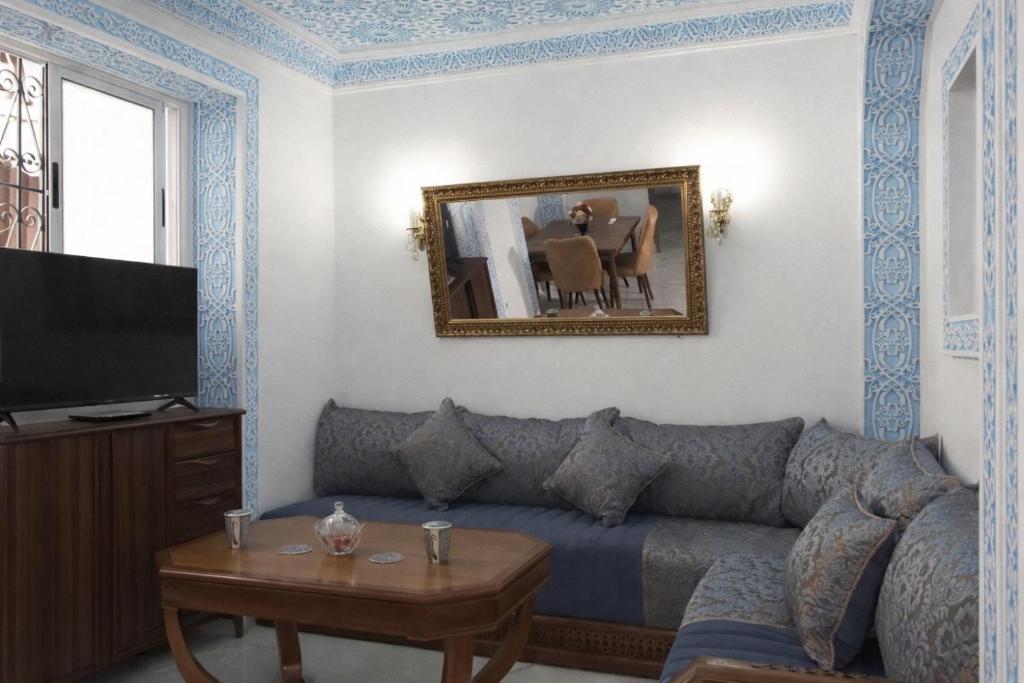 a living room with a couch and a table at Tangier city center 1 in Tangier