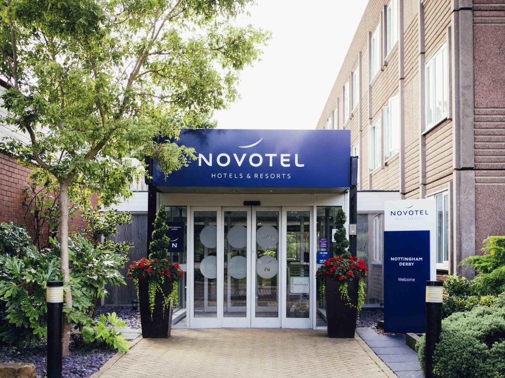 a novouc sign in front of a building at Novotel Nottingham Derby in Long Eaton