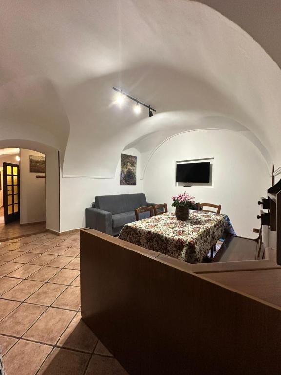 a living room with a couch and a table at Il Dolce Rustico in Dolceacqua