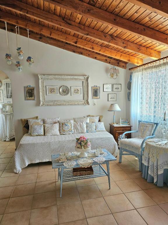 a living room with a couch and a table at Sophy's Cottage in Politika