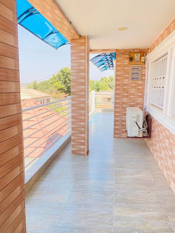a room with a view of a balcony with a window at Amie's Villa Apartment in Jarbang