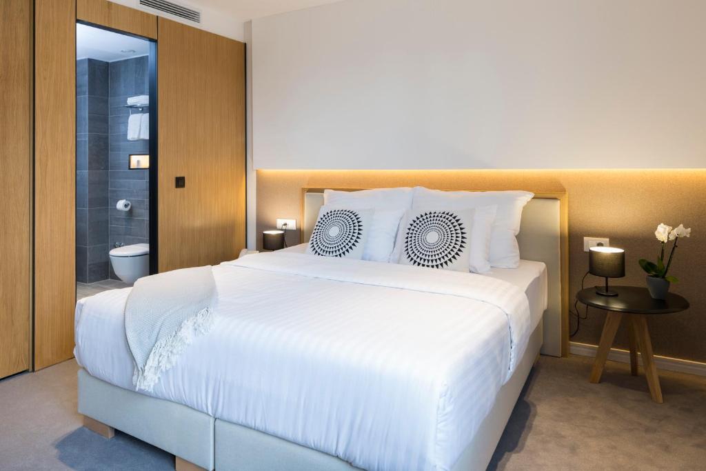 Postel nebo postele na pokoji v ubytování Livris Hotel