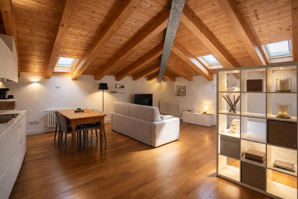 a living room with a couch and a table at Apartments Trieste Centro I 2 in Trieste