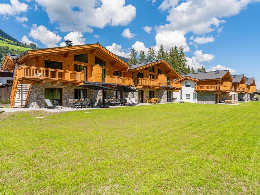 a large log home with a large yard at Pinzgau Lodge 1A in Wald im Pinzgau