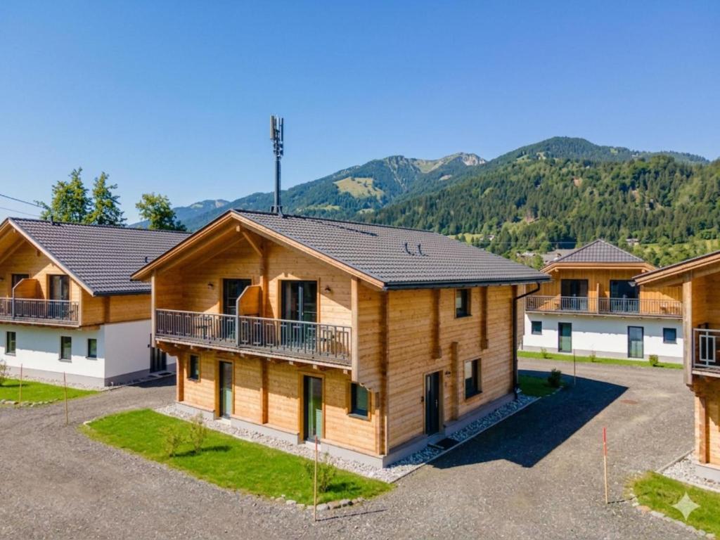 an image of a house with mountains in the background at Rattendorf 21A in Rattendorf
