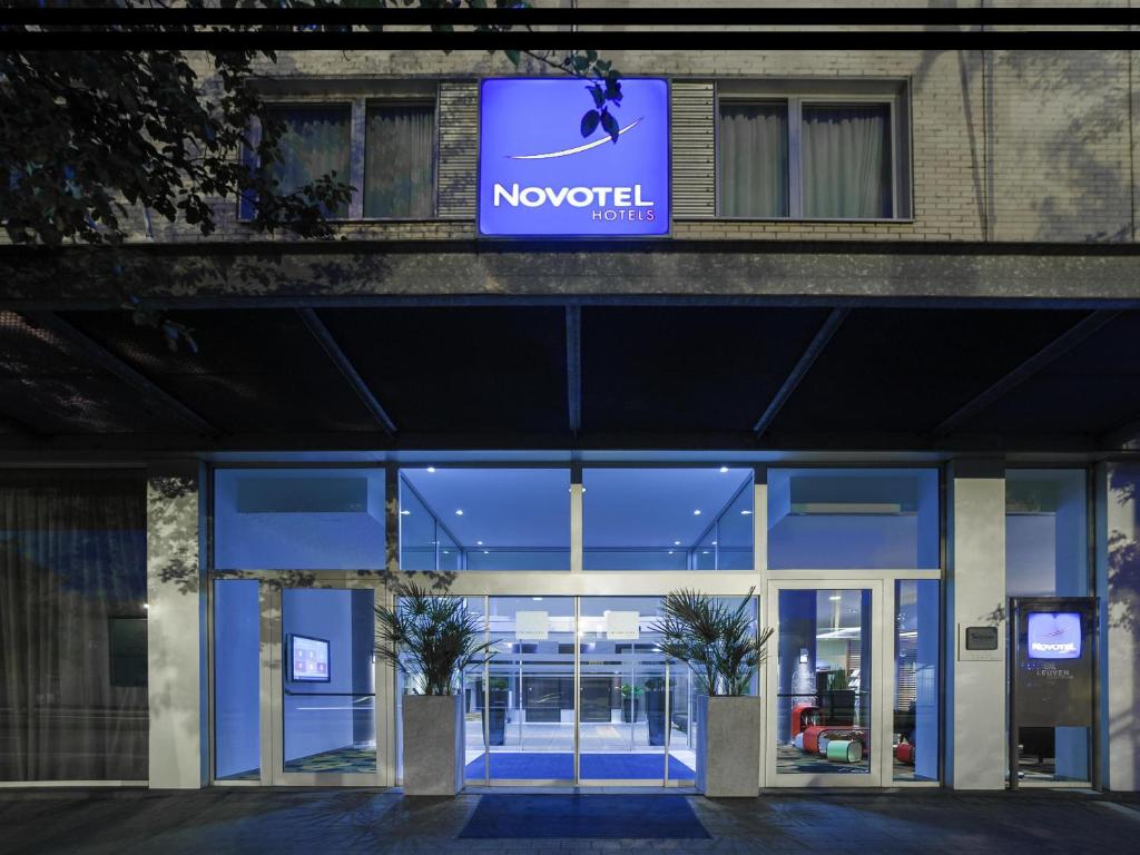 a novotel building with a sign above the door at Novotel Leuven Centrum in Leuven