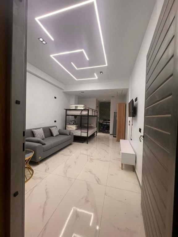 a living room with a couch and a table at Luxury Studio in 6october in 6th Of October
