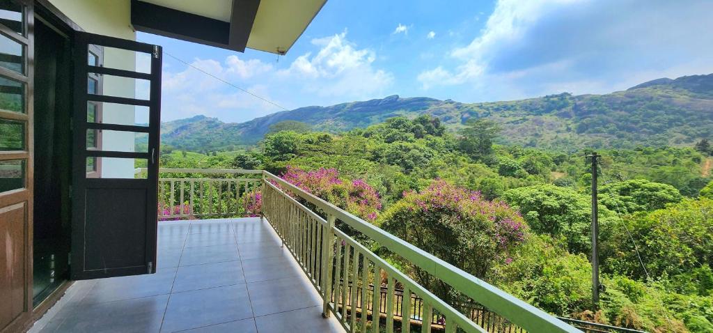 a balcony with a view of the mountains at Roca vista villaas vagamon in Vagamon
