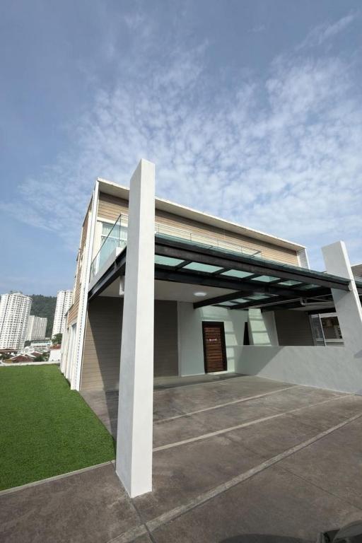 a building with a glass roof on top of it at Penang Gelugor Landed House 4Rooms 3 Bathrooms in Gelugor