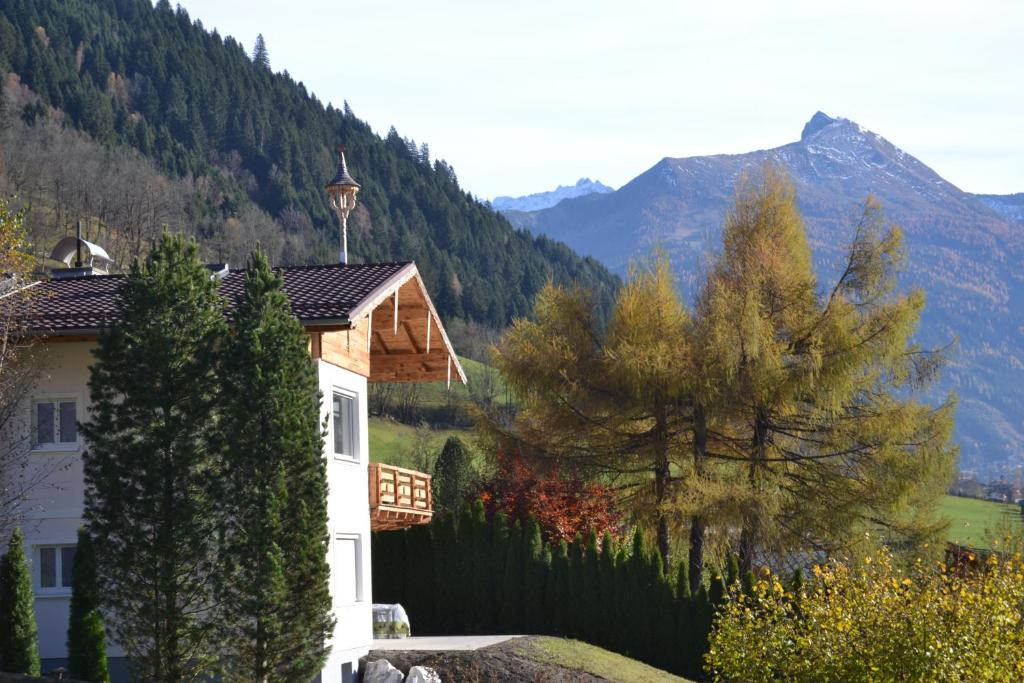 a house with a view of a mountain at AlpenglueckGastein - Private mountain lodge in Bad Hofgastein