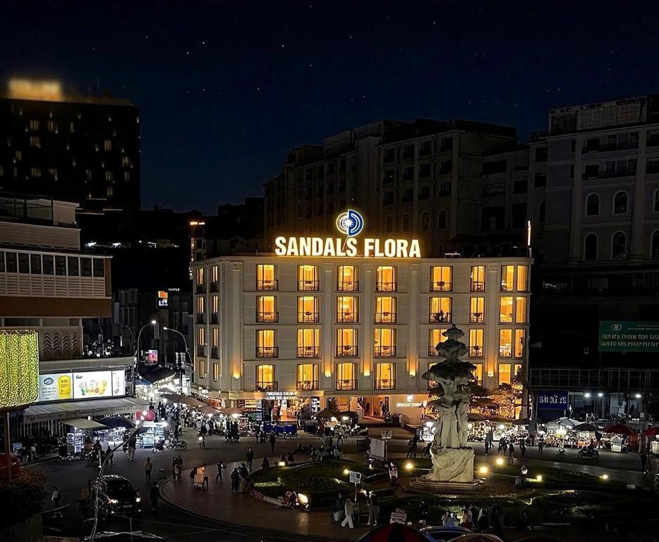 a large building with a samsung honda sign on it at night at SANDALS FLORA HOTEL in Da Lat