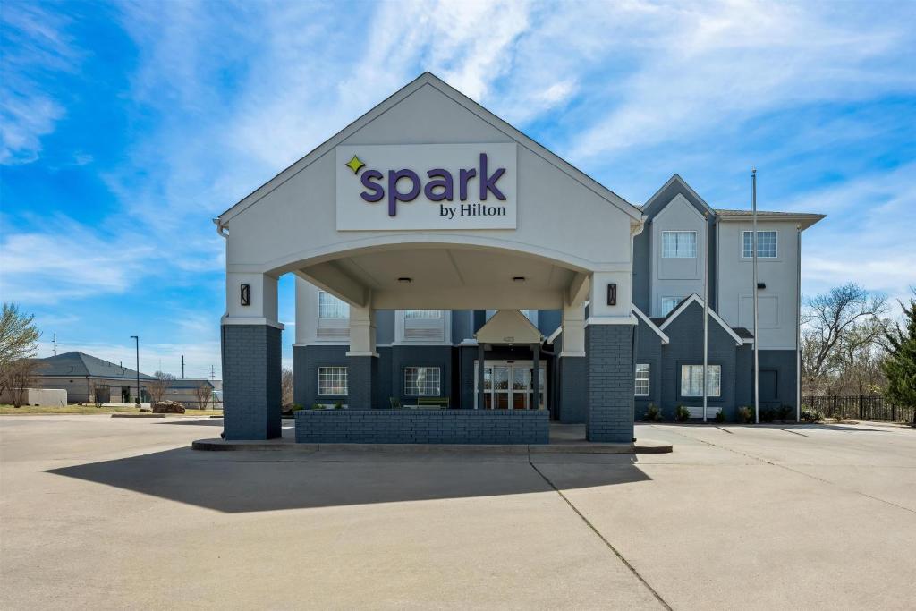 a spark building with a sign on it at Spark by Hilton Stillwater in Stillwater