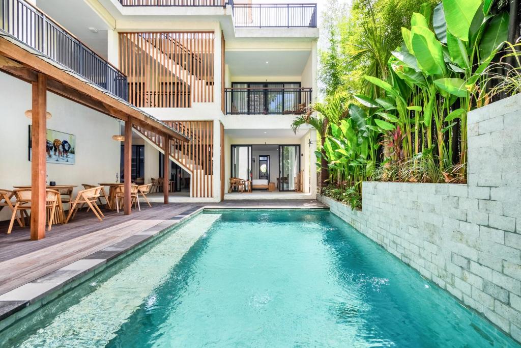 an indoor pool in a house with a villa at Dreamland Suites - Walk to Dreamland Beach in Uluwatu