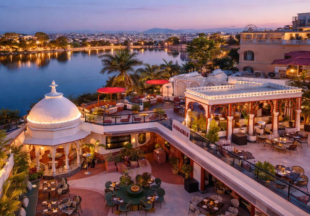 an aerial view of a resort with a lake at Swaroop Vilas - Lake Facing Boutique Hotel in Udaipur