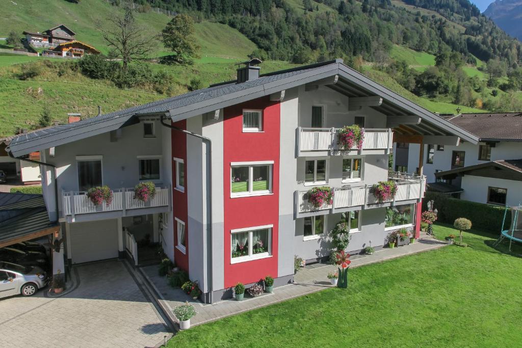 an aerial view of a building with red and gray at Appartement Gimpl in Fusch an der Glocknerstraße
