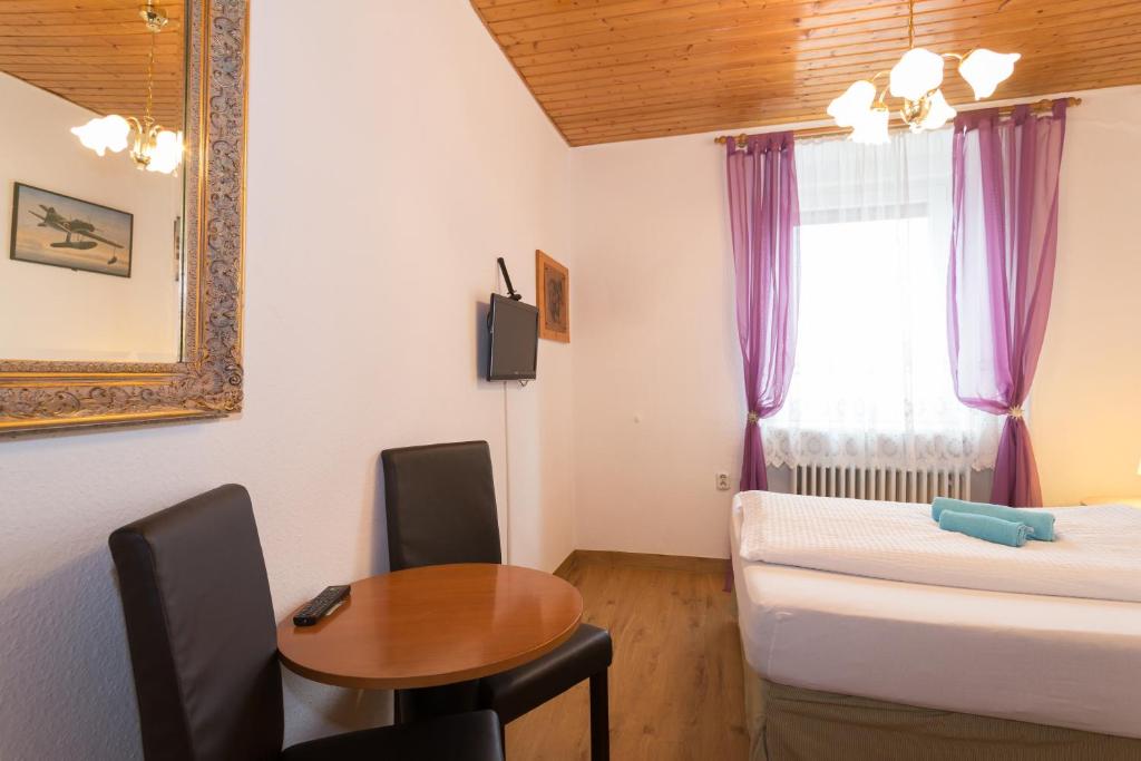 Postel nebo postele na pokoji v ubytování Hotel Moosbichl