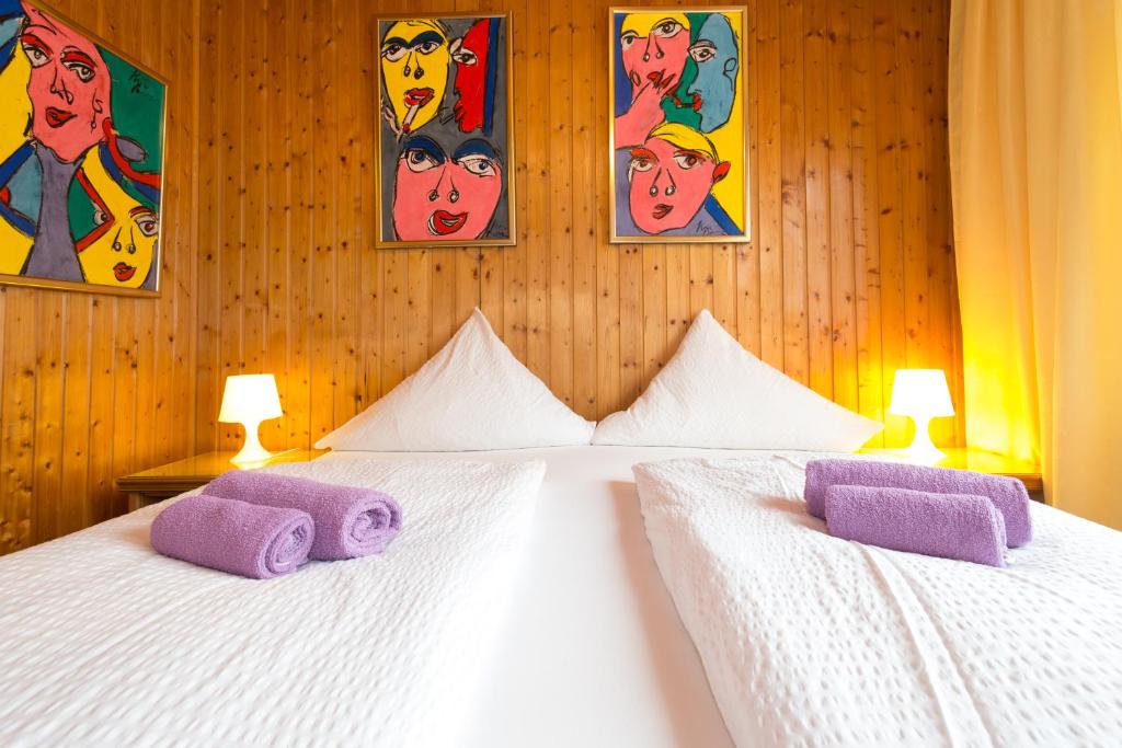 Postel nebo postele na pokoji v ubytování Hotel Moosbichl