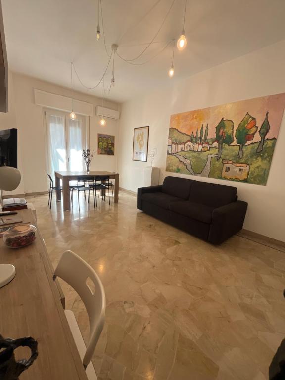 a living room with a couch and a table at Alloggio Primavera in Terni