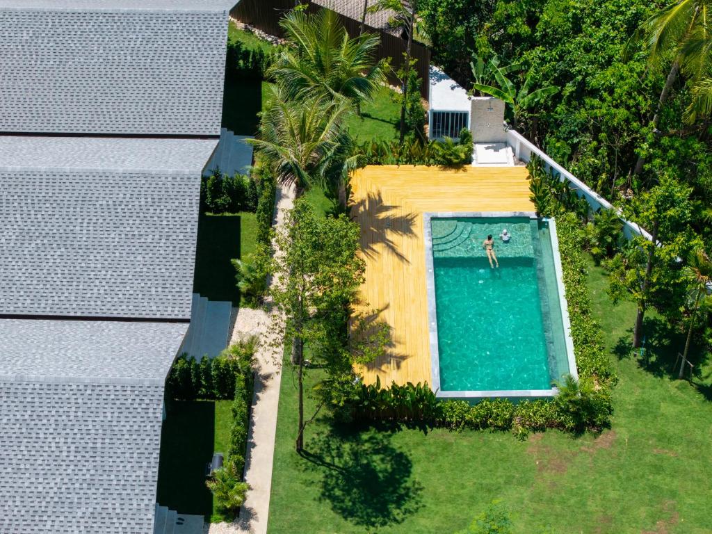 an overhead view of a person in a swimming pool at Siva Pool Villa in Chaloklum