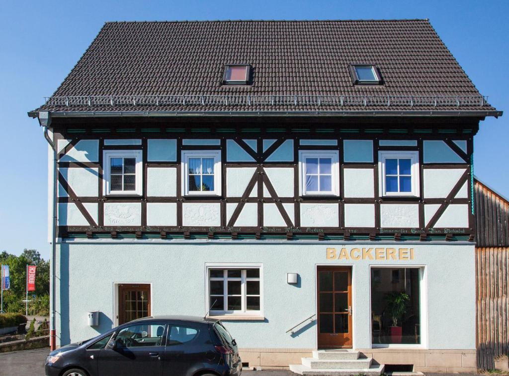 a black car parked in front of a building at Gästehaus-Fulda in Fulda