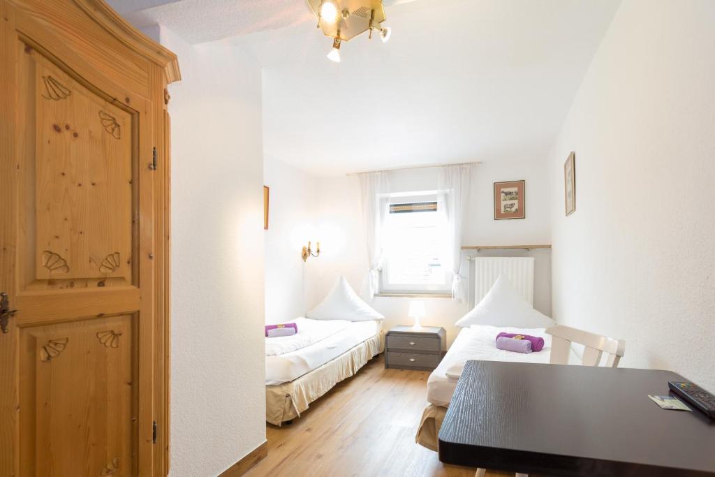 Postel nebo postele na pokoji v ubytování Hotel Moosbichl