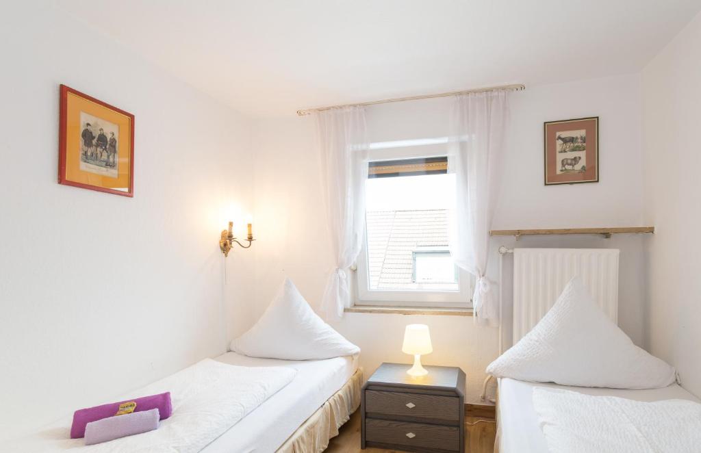 Postel nebo postele na pokoji v ubytování Hotel Moosbichl
